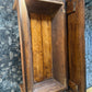 The French antique dough table converted to a coffee table for modern day use shows the lid lifted off to expose the storage space within the coffee table