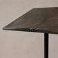 close up of forged iron lectern lip with central hole and aged patina