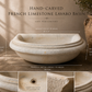 Hand-carved French limestone lavabo basin with dimensions and details.