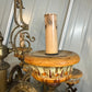 Close-up of an ornate Italian vintage chandelier with intricate details of the antiqued looking candle to hold the bulb