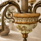 Close-up of an ornate chandelier with intricate details.
