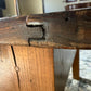 Construction detail shows antique French craftsmanship of the joints in this antique French pine coffee table converted from a dough table
