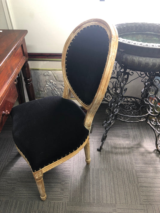 Upholstered oval back chair